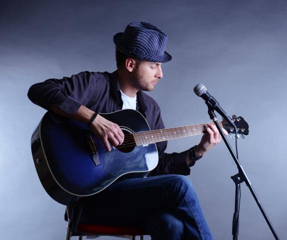 bigstock-Young-musician-playing-acousti-59683289.jpg